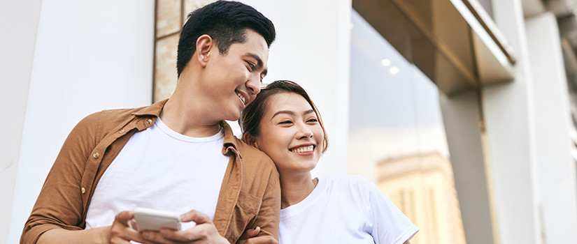 Asian couple out together in a city