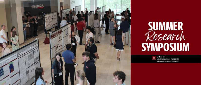 Students and faculty view research posters during the Summer Research Symposium hosted by the University of South Carolina Office of Undergraduate Research.