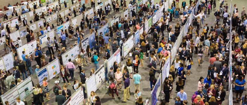 Students presenting at a poster session