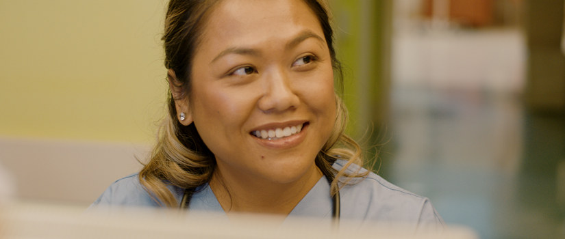 Nurses look at a computerized patient chart