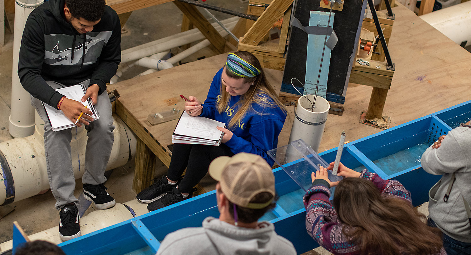 A group of students working together on an engineering experiment. 