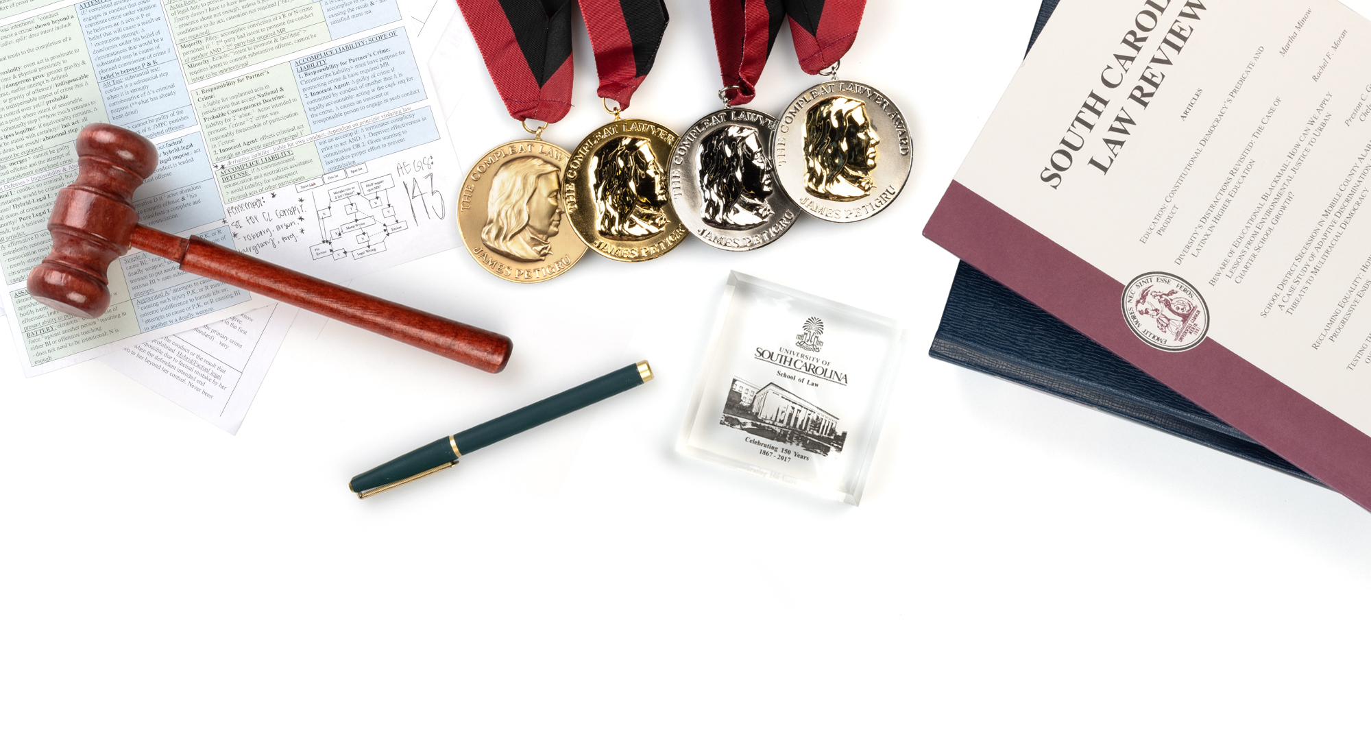 Various items representing the School of Law on a white background.