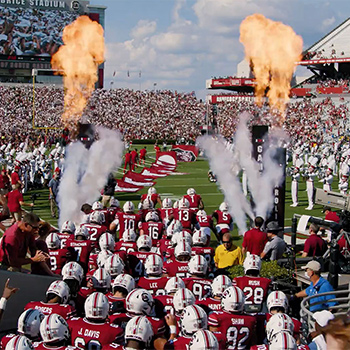 Football team ready to run onto the field.