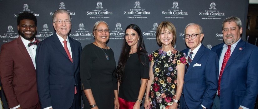 honorees smiling with the Dean at the ROE Awards