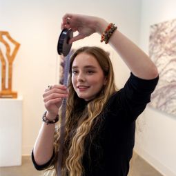 Girl holing film roll in a museum