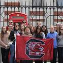 Students holding a USC flag in London