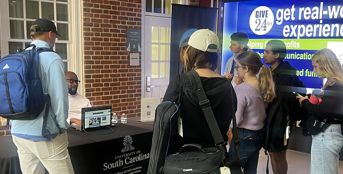 students standing around a table