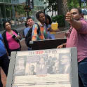 People standing around a sign that reads "Our Story Matters." One person points towards the viewer