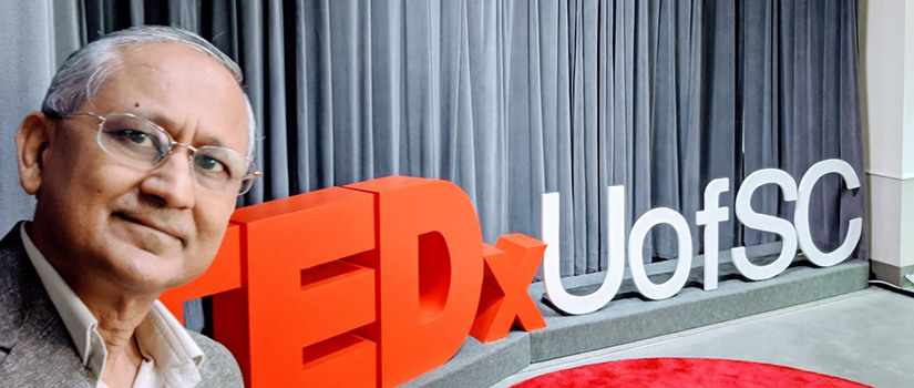 Amit Sheth's selfie in front of the TEDx sign.