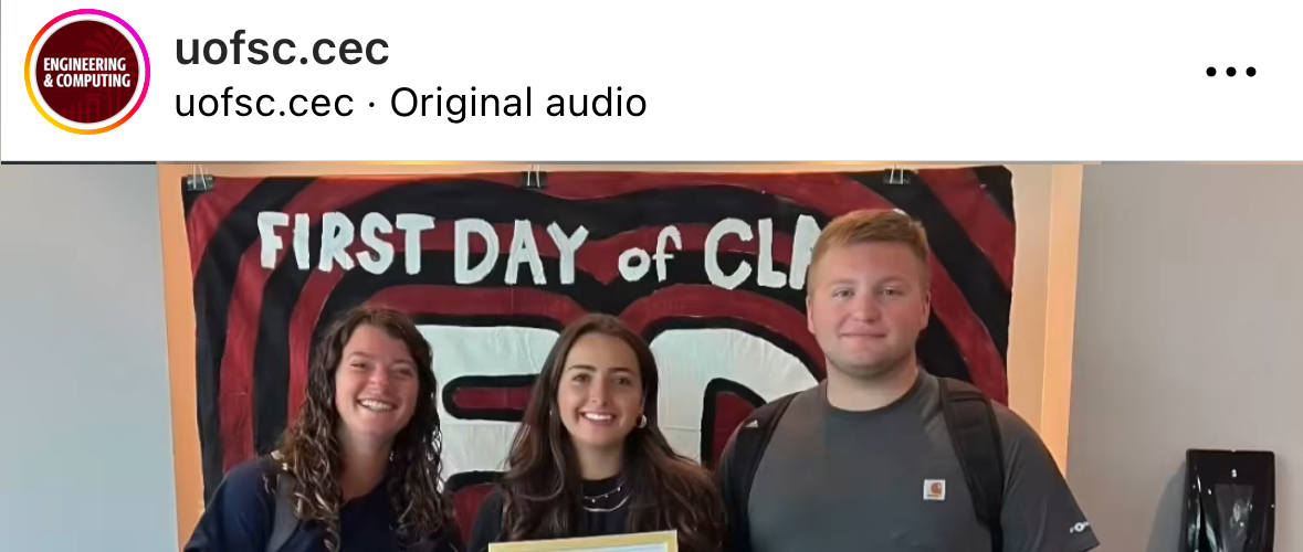 Instagram post of three students on the first day of class in front of first day banner