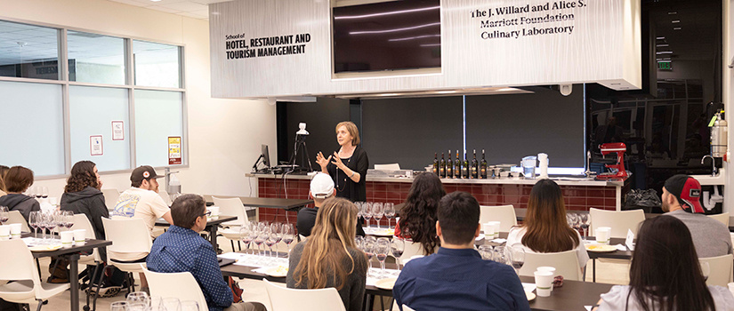 Sandy Strick, director or the Wine and Beverage Institute, conducts a wine class in the Marriott Foundation Culinary Lab at the College of HRSM.