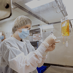 Masked pharmacist in sterile room