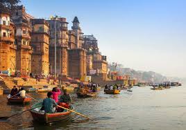 People in boats floating down a river in India