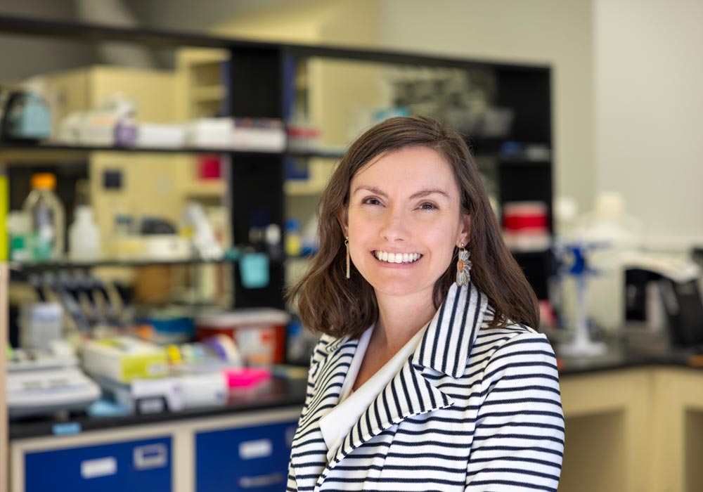 fiona hollis stands in a lab