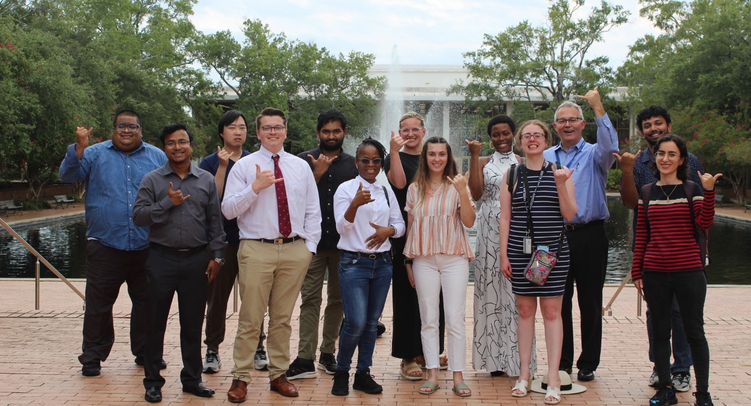 Graduate Student Association members stand in front of Thomas Cooper Library.