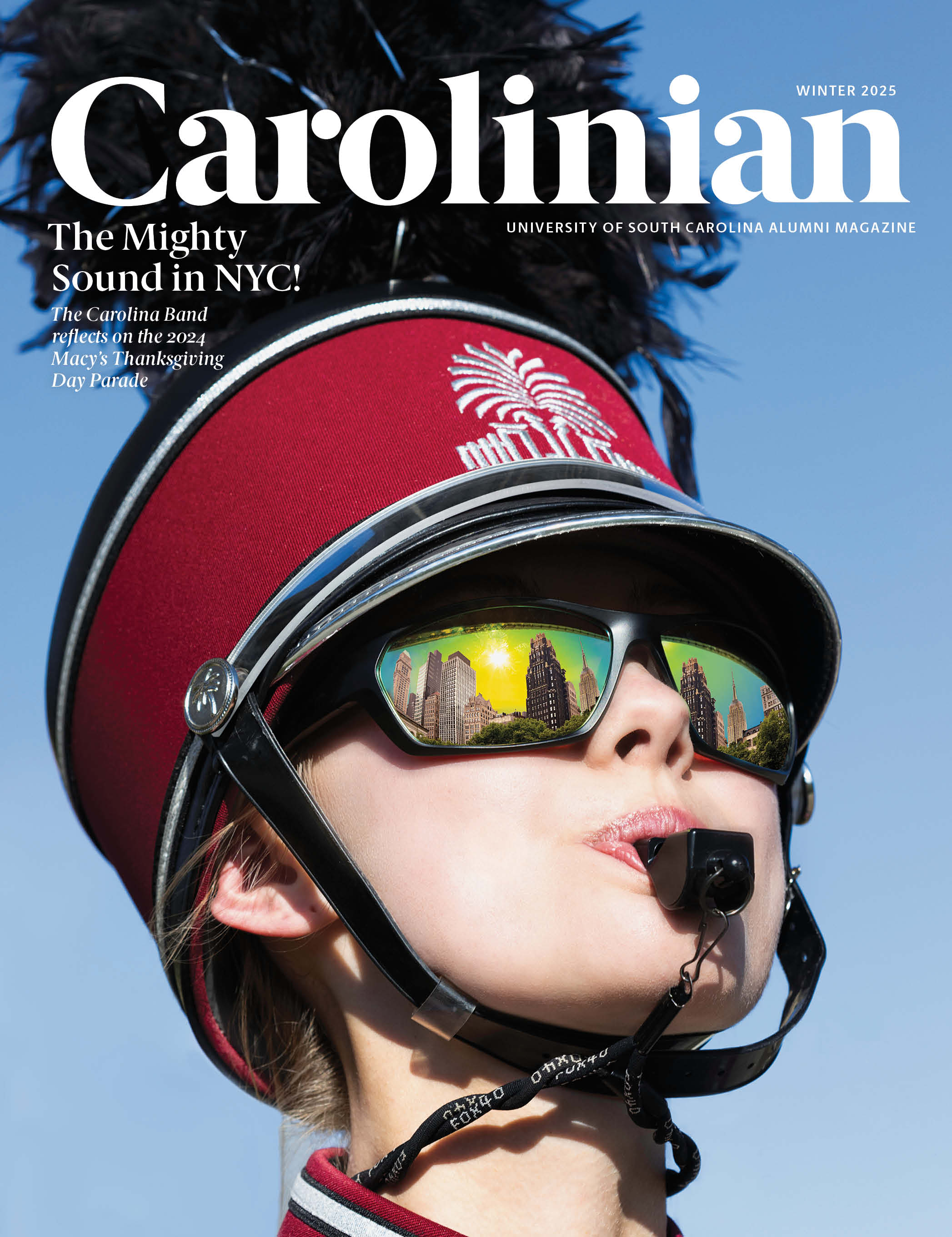 Cover of the Carolinian magazine with Senior biology major Maggie Boyd one of three drum majors in USC’s 2024 marching band.