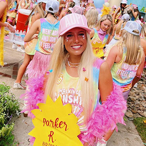 Parker smiling in front of the ADPi house