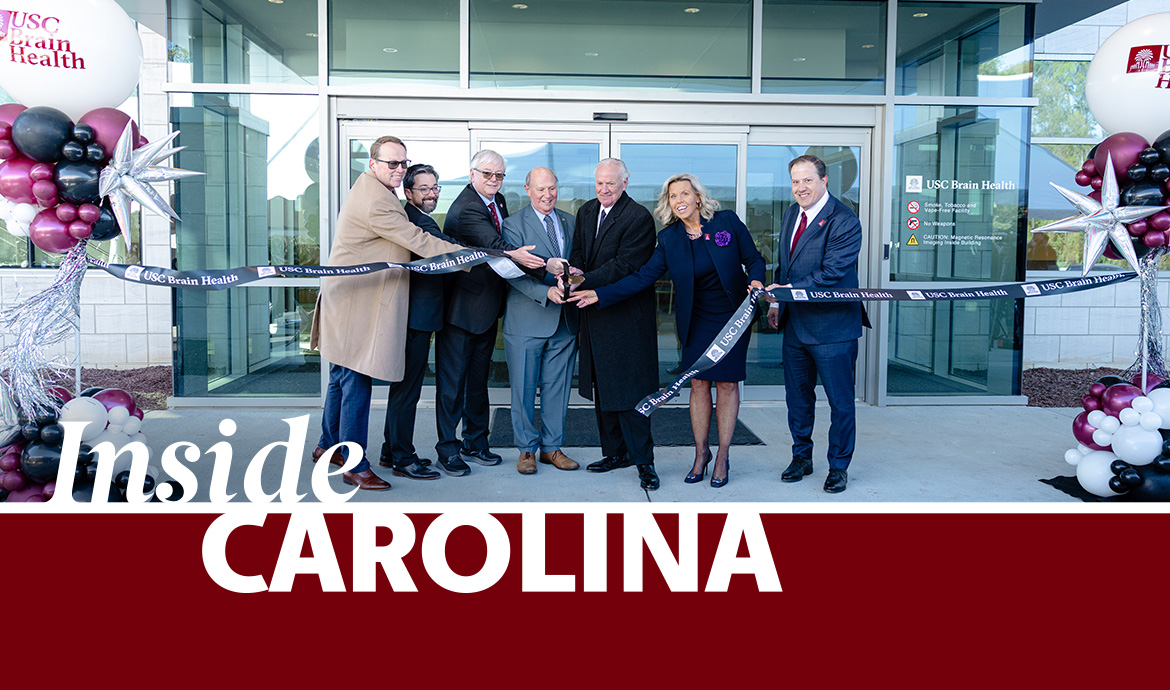 graphic that has a frame with the words Inside Carolina over an image of official cutting a ribbon