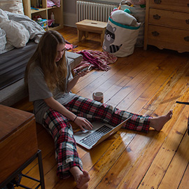 student working from home on a laptop