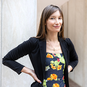 Monica Barra stands outside a building