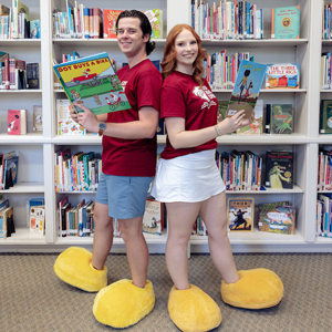 Walker Weaver and Emma Connelly pose with books.