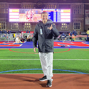 Ian Piihl stands on podium at Penn Relays